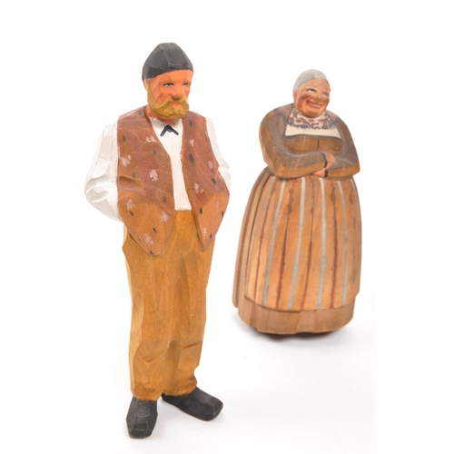 386 - A collection of five 20th century Swiss carved painted folk figures. The figures comprising of a fou... 