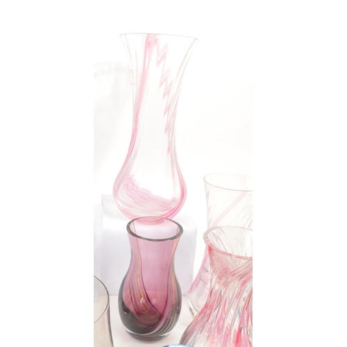 39 - Caithness - A large 20th Century collection of Caithness glass items comprising of vases in various ... 