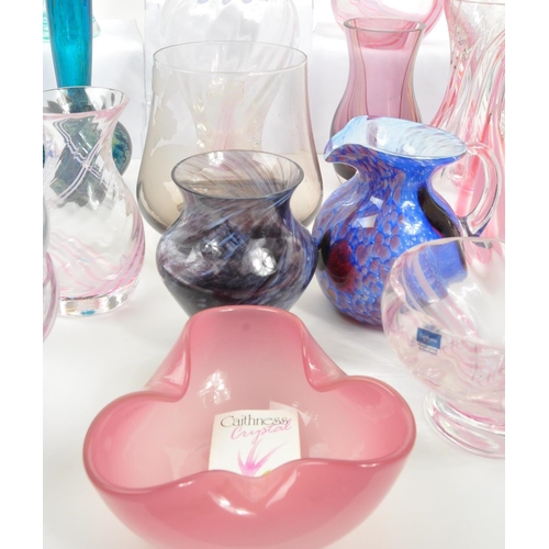 39 - Caithness - A large 20th Century collection of Caithness glass items comprising of vases in various ... 