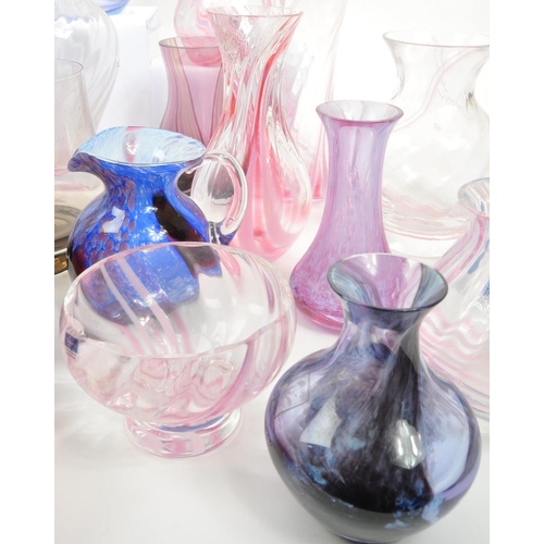 39 - Caithness - A large 20th Century collection of Caithness glass items comprising of vases in various ... 