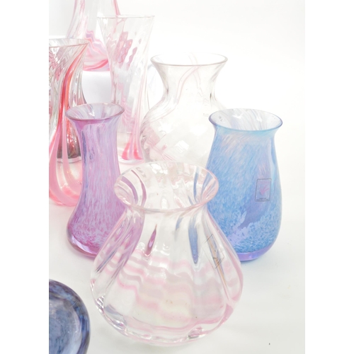 39 - Caithness - A large 20th Century collection of Caithness glass items comprising of vases in various ... 