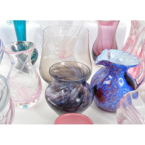 39 - Caithness - A large 20th Century collection of Caithness glass items comprising of vases in various ... 