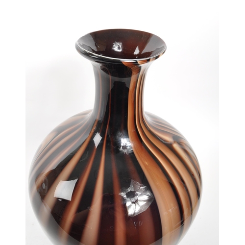 399 - A large mid 20th century studio art glass vase. Having marble effect throughout with flared neck / o... 