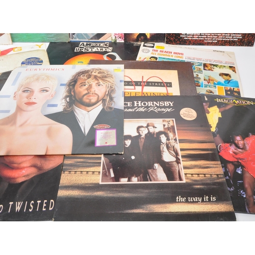 400 - A collection of vintage 20th century long play LP vinyl records. Featuring artists, Kate Bush, Elton... 