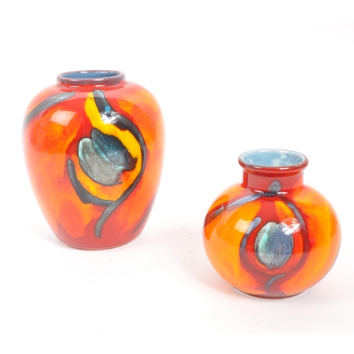 41 - Poole Pottery - Two ceramic Poole Pottery vases in the Peacock pattern. One of small rounded shape w... 