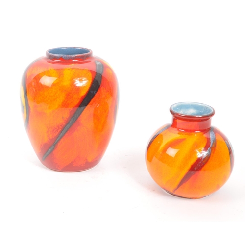 41 - Poole Pottery - Two ceramic Poole Pottery vases in the Peacock pattern. One of small rounded shape w... 