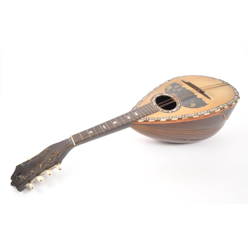 411 - A 19th Century bowl back mandolin musical instrument, with tortoiseshell scratch plate and mother of... 