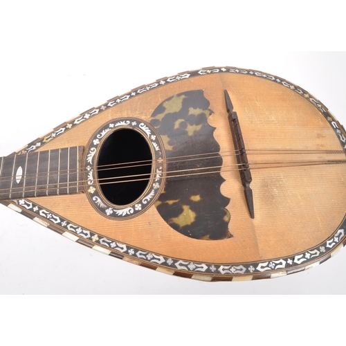 411 - A 19th Century bowl back mandolin musical instrument, with tortoiseshell scratch plate and mother of... 