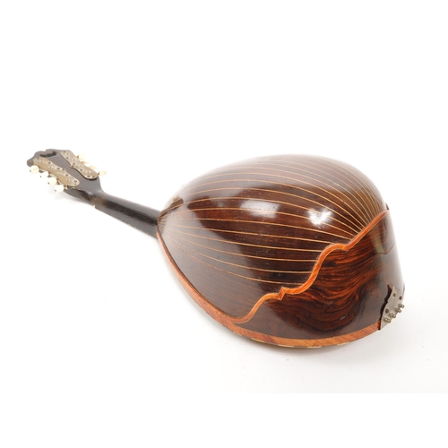 411 - A 19th Century bowl back mandolin musical instrument, with tortoiseshell scratch plate and mother of... 