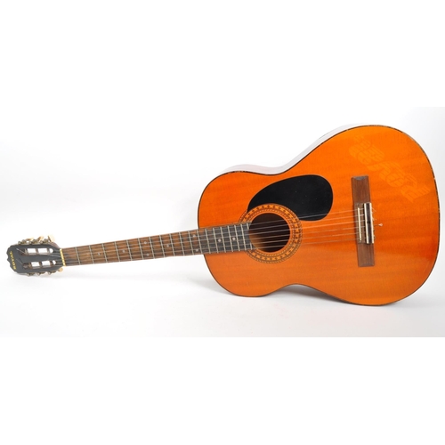 413 - A 20th Century 1970s Royal acoustic guitar with black scratch plate and decorative border to sound h... 