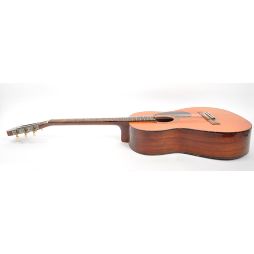 413 - A 20th Century 1970s Royal acoustic guitar with black scratch plate and decorative border to sound h... 