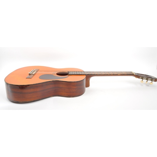 413 - A 20th Century 1970s Royal acoustic guitar with black scratch plate and decorative border to sound h... 