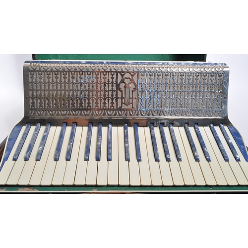 418 - Sivori - A vintage mid 20th century Italian Sivori piano accordion. The accordion having body in a b... 