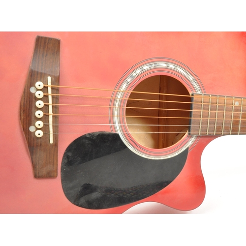 420 - Lindo - A contemporary Lindo acoustic guitar. The guitar having a red body, with black scratch plate... 