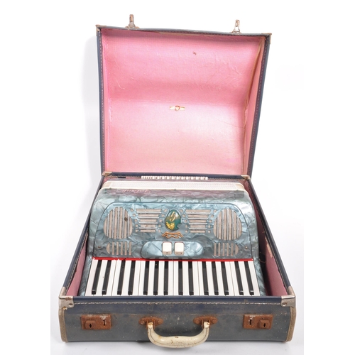 426 - A vintage 20th Century Italian Galanti made accordion with carry case. The accordion having a green ... 