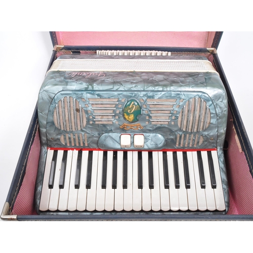 426 - A vintage 20th Century Italian Galanti made accordion with carry case. The accordion having a green ... 