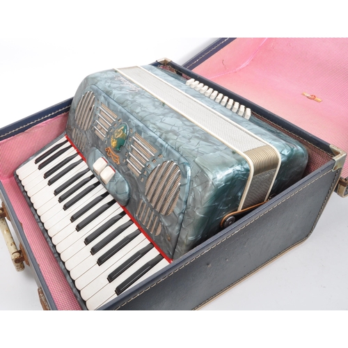 426 - A vintage 20th Century Italian Galanti made accordion with carry case. The accordion having a green ... 