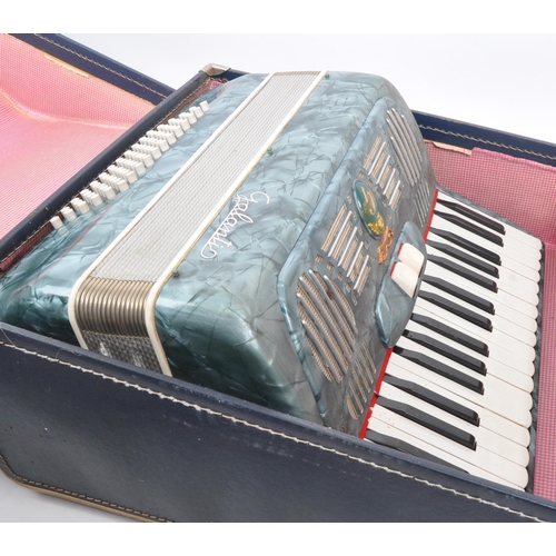 426 - A vintage 20th Century Italian Galanti made accordion with carry case. The accordion having a green ... 