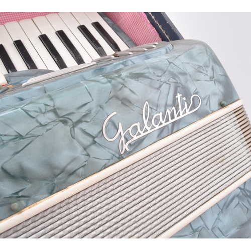 426 - A vintage 20th Century Italian Galanti made accordion with carry case. The accordion having a green ... 