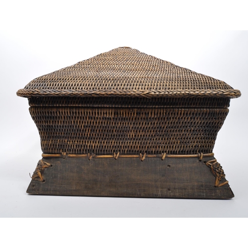 434 - A large Chinese bamboo wicker storage basket in Pagoda shape set on a wooden base with plaited detai... 