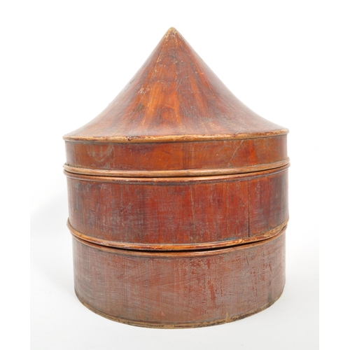 435 - A 19th Century Chinese wooden hat box. Cylindrical box with conical lid cover and chinese symbols on... 