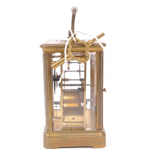 436 - An early 20th century brass carriage mantel clock. Movement to verso, white face with ebonised chapt... 