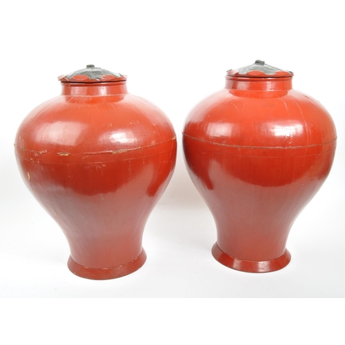 442 - Pair of red lacquered Chinese Asian lidded vase / urns / planters. Bulbous form, wooden construction... 