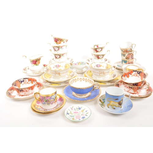 452 - A collection of assorted fine bone china cabinet cups and saucers to include Royal Crown Derby, Roya... 