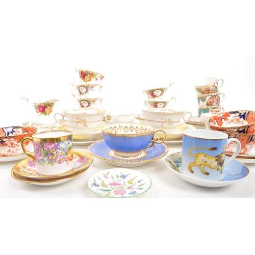 452 - A collection of assorted fine bone china cabinet cups and saucers to include Royal Crown Derby, Roya... 