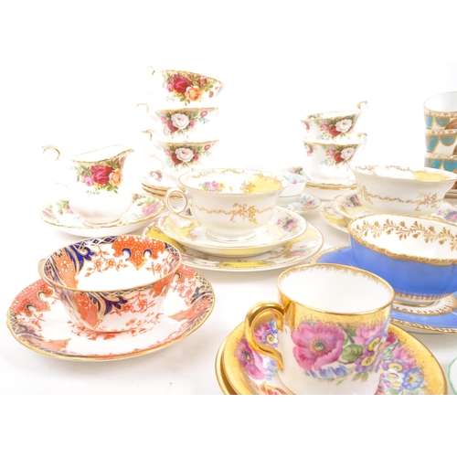 452 - A collection of assorted fine bone china cabinet cups and saucers to include Royal Crown Derby, Roya... 