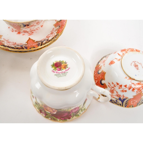 452 - A collection of assorted fine bone china cabinet cups and saucers to include Royal Crown Derby, Roya... 