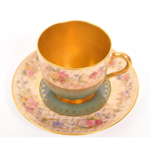 455 - An early 20th Century 1930s Royal Worcester gold plated cup and saucer with olive green and floral d... 