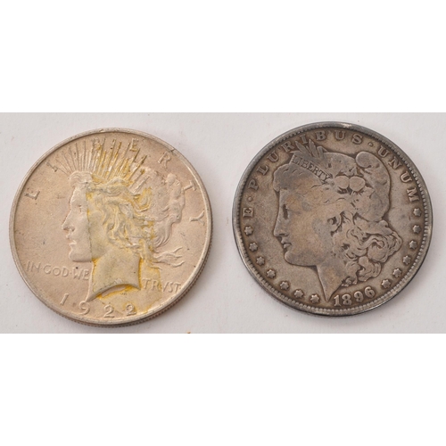 512 - An 1896 USA ' Morgan ' Dollar coin, alongside a 1922 ' Peace ' Dollar. Each of the dollars being of ... 