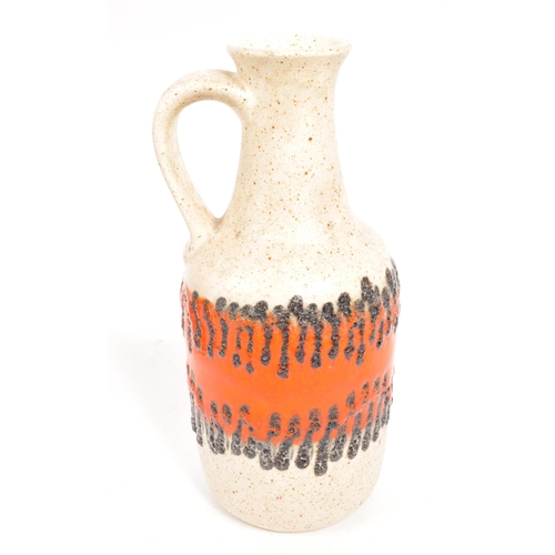 54 - West German Pottery - A mid 20th century West German ceramic vase and jug. The vase marked ' 517-30 ... 