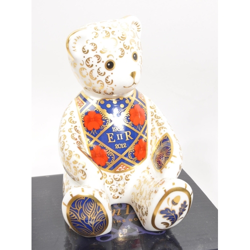 61 - Royal Crown Derby - A collection of three porcelain china Royal Crown Derby teddy bear paperweights ... 