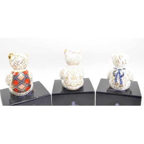 61 - Royal Crown Derby - A collection of three porcelain china Royal Crown Derby teddy bear paperweights ... 