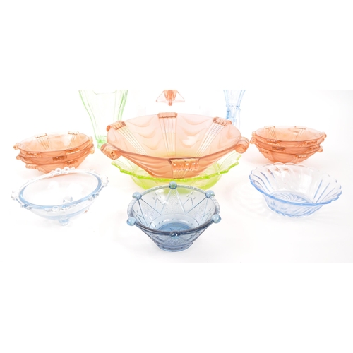 66 - A collection of 20th Century coloured Art Deco glass item. Comprising of pink centre piece bowl with... 