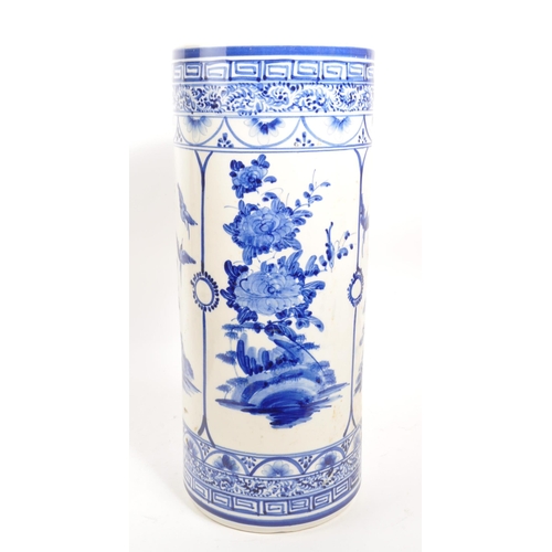 68 - A 20th century Japanese blue and white ceramic umbrella stand. The umbrella stand of cylindrical for... 