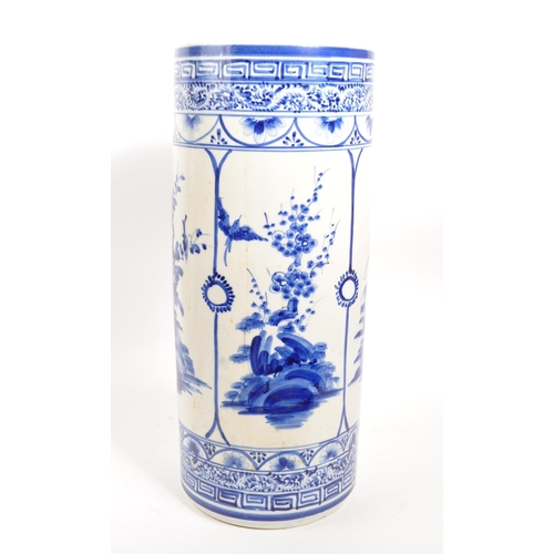 68 - A 20th century Japanese blue and white ceramic umbrella stand. The umbrella stand of cylindrical for... 