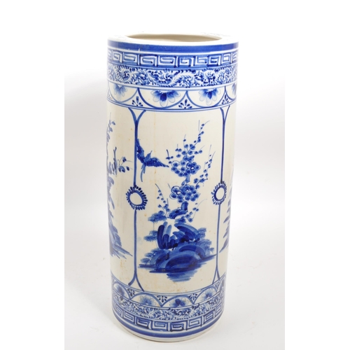 68 - A 20th century Japanese blue and white ceramic umbrella stand. The umbrella stand of cylindrical for... 