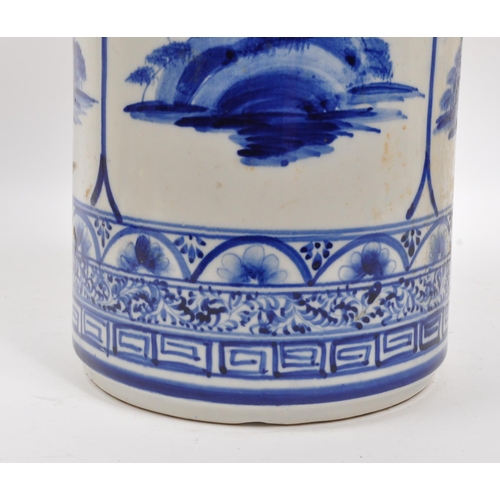 68 - A 20th century Japanese blue and white ceramic umbrella stand. The umbrella stand of cylindrical for... 