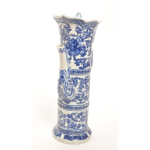 73 - A 20th Century vintage Chinese porcelain blue and white lidded wine pot / wine jug. Having floral mo... 