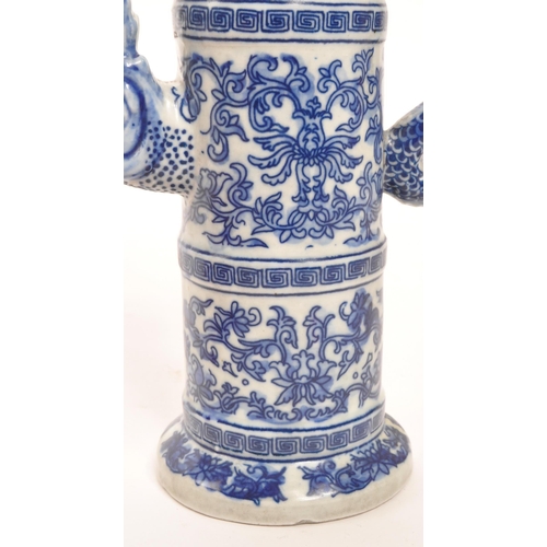 73 - A 20th Century vintage Chinese porcelain blue and white lidded wine pot / wine jug. Having floral mo... 