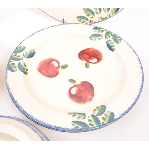 77 - Poole Pottery - A collection of contemporary plates, of various sizes with cherry print for decorati... 