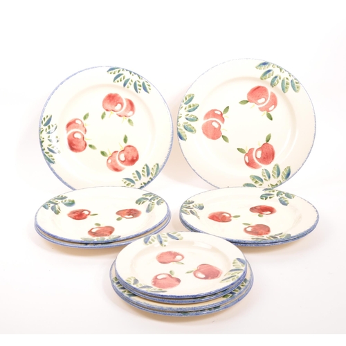 77 - Poole Pottery - A collection of contemporary plates, of various sizes with cherry print for decorati... 