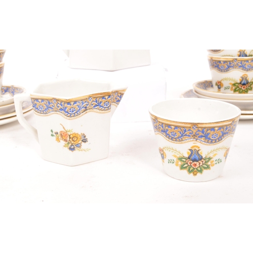 78 - A vintage 20th century child's porcelain tea / coffee service. Four place settings including teapots... 