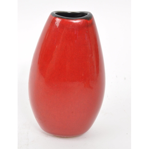 81 - Poole Pottery - A vintage 20th century volcano ceramic pottery small bud / stem vase. Red ground wit... 