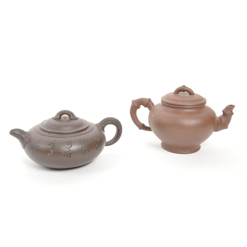 85 - Two 20th Century Chinese ceramic teapots one squat example early 20th Century having engraved cherry... 