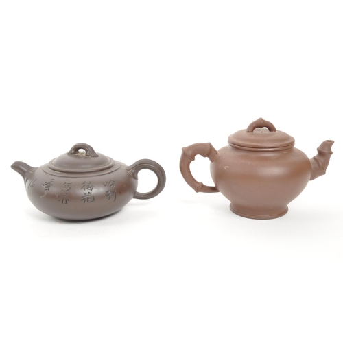 85 - Two 20th Century Chinese ceramic teapots one squat example early 20th Century having engraved cherry... 