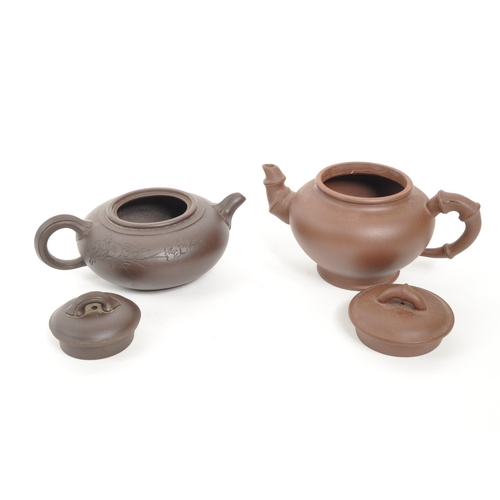 85 - Two 20th Century Chinese ceramic teapots one squat example early 20th Century having engraved cherry... 